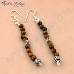 Load image into Gallery viewer, 925 sterling silver dangle earrings with tiger eye beads in warm brown tones.