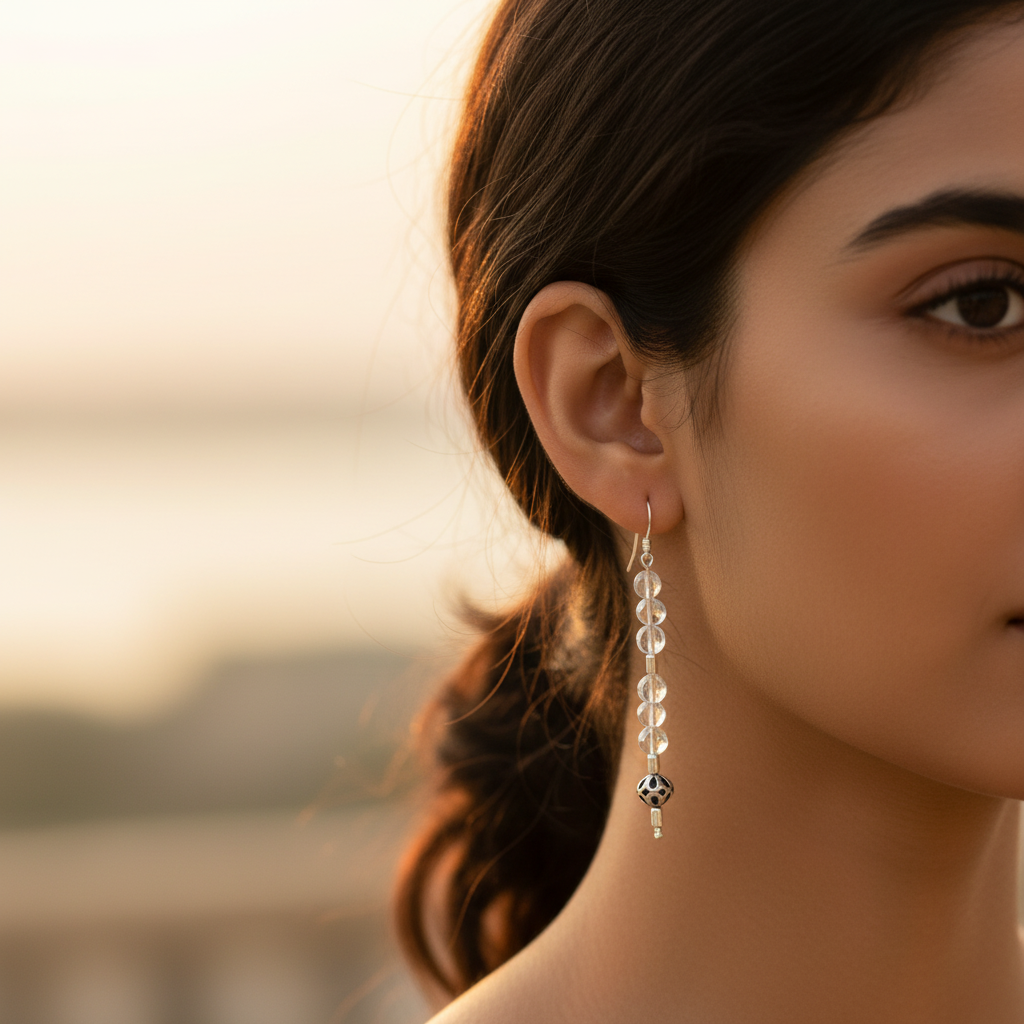 925 sterling silver drop earrings with clear faceted stones, silver hooks, and a detailed ball at the end