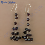 Load image into Gallery viewer, Sterling silver drop earrings with cascading garnet beads and silver hooks, showcasing a classic and elegant design.
