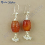 Load image into Gallery viewer, 925 sterling silver dangle earrings featuring carnelian barrel beads in orange.