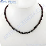 Load image into Gallery viewer, Garnet bead necklace on a mannequin. Red gemstone necklace.