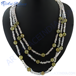Load image into Gallery viewer, Multi-strand necklace featuring green jade and clear crystal beads on a black background.