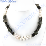Load image into Gallery viewer, Elegant beaded necklace with white pearls and dark gemstones, perfect for women.
