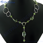 Load image into Gallery viewer, 925 sterling silver peridot gemstone necklace on a black mannequin, featuring a unique and modern design