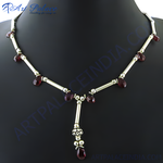 Load image into Gallery viewer, Sterling silver necklace with dark red garnet gemstones on a black mannequin