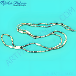 Load image into Gallery viewer, Multi-color pearl bead necklace with a variety of pearl colors and shapes against a teal background.
