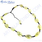 Load image into Gallery viewer, Yellow citrine beaded necklace with a black cord, showcasing the light yellow gemstones.