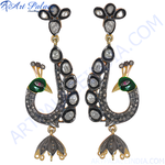 Load image into Gallery viewer, Peacock dangle earrings with green enamel detailing, diamonds, and black metal accents on a white background.