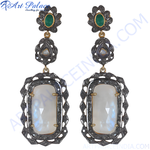 Load image into Gallery viewer, Elegant drop earrings featuring moonstone gemstones and emerald accents, crafted from oxidized metal.