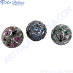 Load image into Gallery viewer, Close-up of three sterling silver beaded ball beads with various colored gemstones embedded in a geometric pattern.