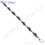 Load image into Gallery viewer, Sterling silver bracelet featuring blue gemstones, a beautiful and elegant piece for women.
