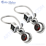Load image into Gallery viewer, Sterling silver drop earrings with round red garnet gemstones, perfect for any occasion.
