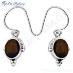 将图像加载到图库查看器中, 925 sterling silver dangle earrings featuring oval-shaped tiger eye gemstones.