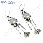 Load image into Gallery viewer, 925 sterling silver moonstone dangle earrings, featuring oval cut gemstones and intricate design.