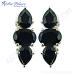 Load image into Gallery viewer, Silver drop earrings featuring black onyx gemstones in a teardrop design.