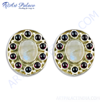 Load image into Gallery viewer, 925 silver stud earrings featuring a central moonstone gemstone surrounded by red garnet accents.