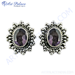 Load image into Gallery viewer, 925 sterling silver stud earrings with oval amethyst gemstones and ornate silver detailing.