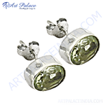 Load image into Gallery viewer, 925 sterling silver peridot stud earrings with oval-cut green gemstone, perfect for everyday wear.