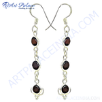 Load image into Gallery viewer, 925 sterling silver drop earrings with oval-cut red garnet gemstones.