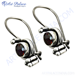 Load image into Gallery viewer, 925 sterling silver dangle earrings featuring round-cut red garnet gemstones.