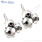 Load image into Gallery viewer, 925 sterling silver dangle earrings with floral design and red garnet gemstones.