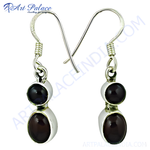 Load image into Gallery viewer, 925 sterling silver drop earrings with oval garnet gemstones, showcasing a classic design and rich red color.