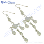 Load image into Gallery viewer, Sterling silver dangle earrings with pear-shaped moonstone gemstones and a hook closure.