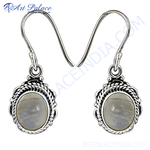 Load image into Gallery viewer, Sterling silver drop earrings with oval moonstone gemstones and decorative detailing.
