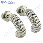 Load image into Gallery viewer, Silver hoop earrings with a twisted design, perfect for women's daily wear.