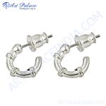 Load image into Gallery viewer, Silver hoop earrings with a unique knot design, perfect for women.