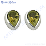 Load image into Gallery viewer, 925 sterling silver teardrop stud earrings with a peridot gemstone. These earrings are green.