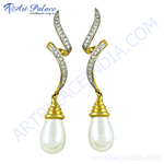 Load image into Gallery viewer, Gold drop earrings with pear-shaped pearls and diamond accents on a white background.