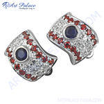 Load image into Gallery viewer, 925 sterling silver stud earrings with blue sapphires, red garnets, and sparkling white cubic zirconia