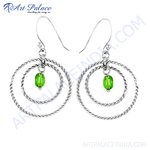 Load image into Gallery viewer, Sterling silver hoop earrings with green gemstone accents, a stylish and elegant jewelry piece.