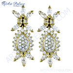 Load image into Gallery viewer, Gold earrings featuring a teardrop and flower design, adorned with cubic zirconia stones.
