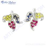 Load image into Gallery viewer, Silver stud earrings featuring a leaf design with ruby, sapphire, and yellow gemstones.