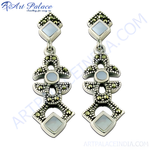 Load image into Gallery viewer, 925 sterling silver dangle earrings with marcasite stones and mother of pearl accents. Silver earrings with a white background.