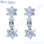 Load image into Gallery viewer, Silver drop earrings featuring a flower design and sparkling cubic zirconia stones.