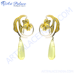 Load image into Gallery viewer, Gold dangle earrings featuring a floral design with diamonds and yellow gemstone drops.