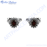 Load image into Gallery viewer, Sterling silver cufflinks with oval-cut garnet gemstones, perfect for formal wear.