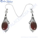 Load image into Gallery viewer, 925 sterling silver drop earrings with oval-cut red garnet gemstones.