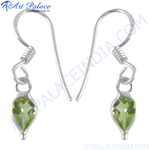 Load image into Gallery viewer, 925 sterling silver drop earrings with pear-shaped green peridot gemstones.