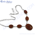 Load image into Gallery viewer, 925 sterling silver necklace featuring oval-shaped carnelian gemstones. The reddish-brown stones are set in a silver bezel setting.