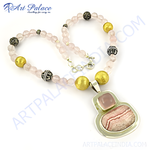 Load image into Gallery viewer, Sterling silver necklace with a rose quartz pendant and pink gemstone beads