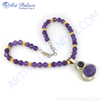 Load image into Gallery viewer, Amethyst beaded necklace with a silver pendant and purple gemstone. A beautiful necklace with gold accents.