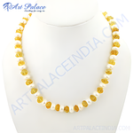 Load image into Gallery viewer, Yellow amber and pearl beaded necklace displayed on a white bust, showcasing the natural gemstones.