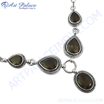 Load image into Gallery viewer, Sterling silver necklace featuring smoky quartz gemstones in a teardrop design, set against a white background.