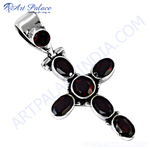 Load image into Gallery viewer, 925 sterling silver cross pendant necklace with oval-cut garnet gemstones in a cross pattern.