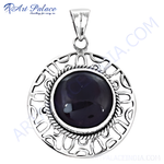 Load image into Gallery viewer, 925 sterling silver round pendant with a dark gemstone center and intricate openwork design.