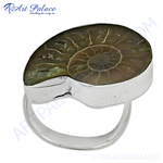 Load image into Gallery viewer, Sterling silver ring featuring a polished ammonite fossil with spiral patterns.